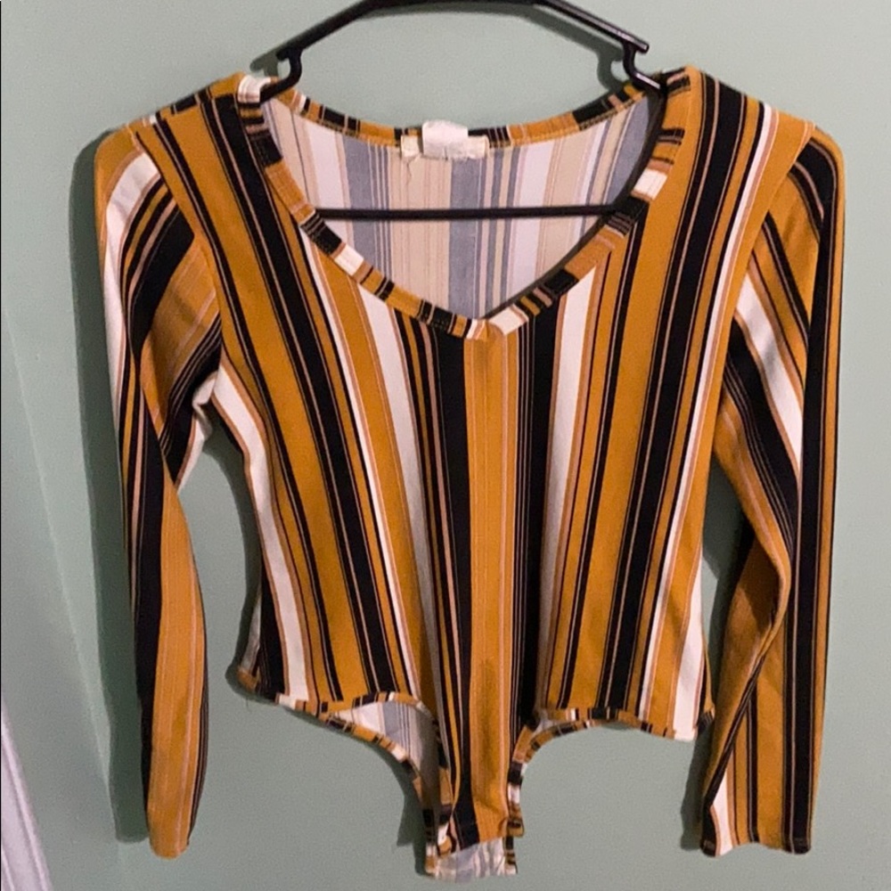 It’s a bodysuit it’s black and white and orange